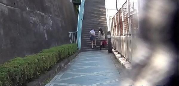  Embarrassed asian pissing outdoors